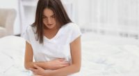 bigstock-Young-woman-suffering-from-stomach pain diarrhea medication