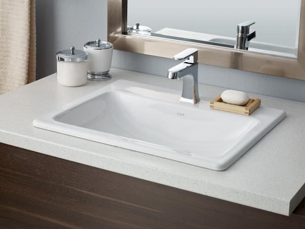 drop-in basin for bathroom with decorative mirror behind