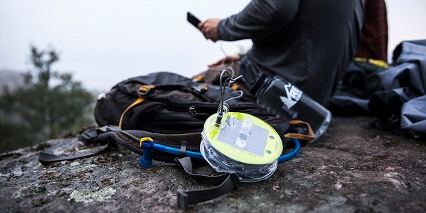 navigation, power source, backpack and a person scrolling on his phone