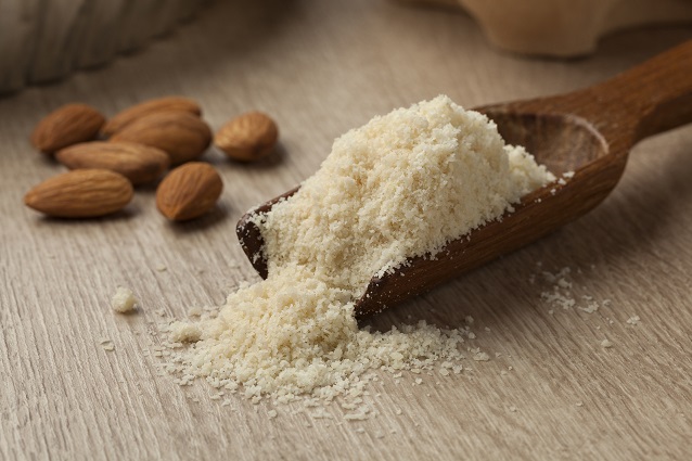 almond gluten free flour in wooden spoon