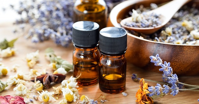 essential oils on wooden table 