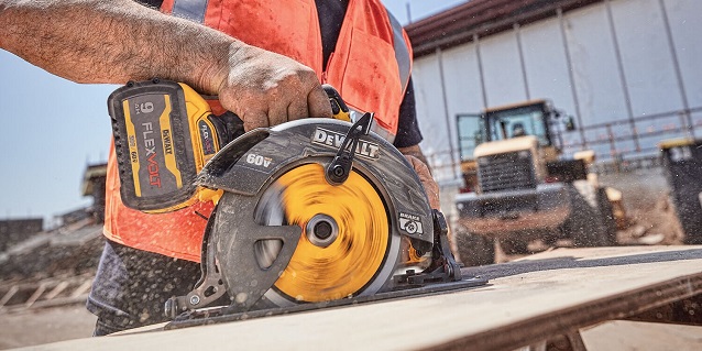 close-up of working with dewalt cordless circular saw