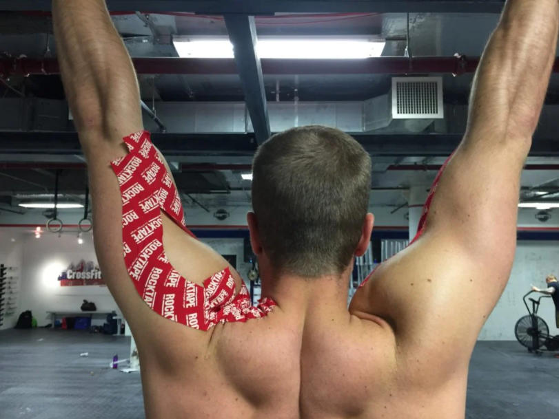 Man working out while having a rocktape on his hand