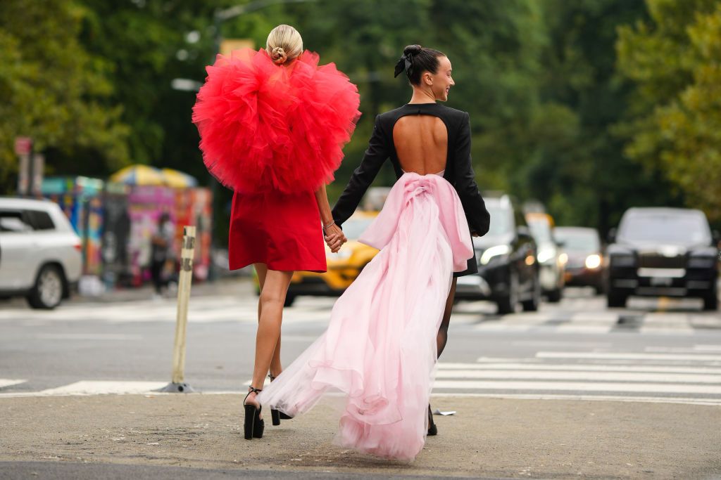 two women wearing formal dresses