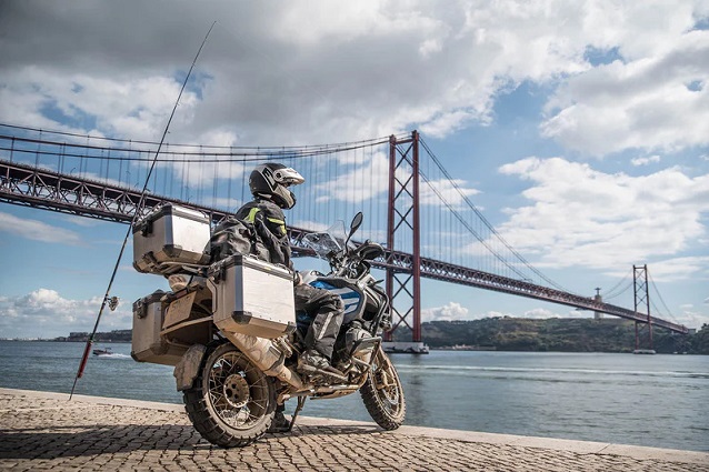 Motorcycle with wop boxes parked by the river