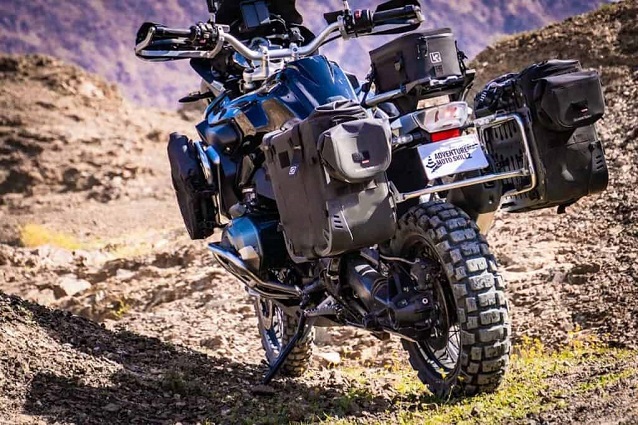 Motorcycle with luggage parked in nature