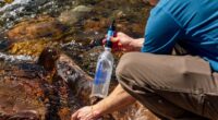person using Survival Water Filtration System
