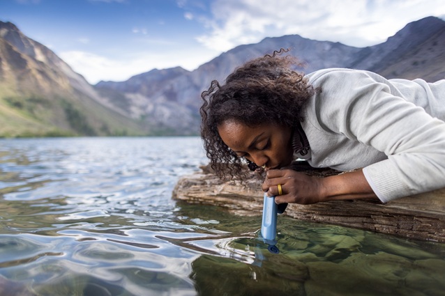 woman using LifeStraw Personal Water Filter