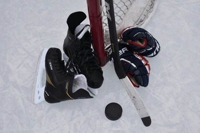 hockey skates, stick and gloves