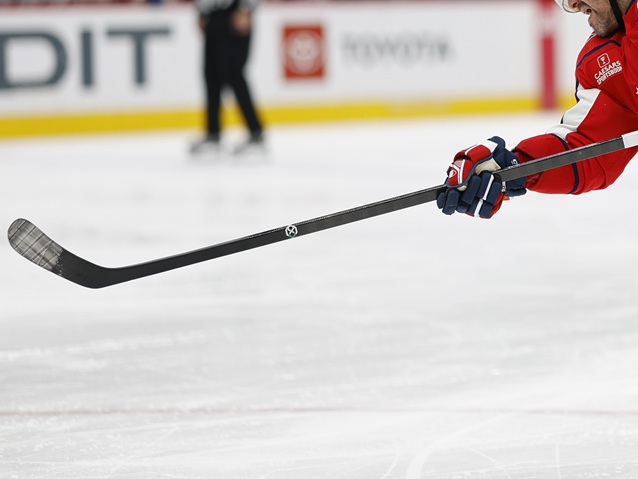 hockey player with a pro stock hockey stick