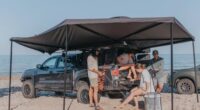 people under overland awning